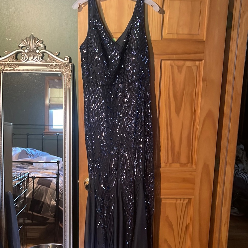 Long sleeveless sequins gown with chiffon inlays at bottom